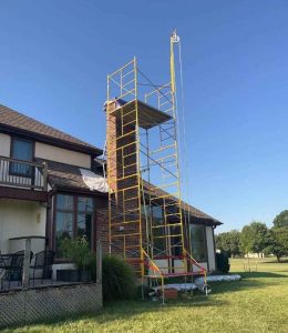 Damaged chimney flashing causing water leak on a Kansas City roof inspected by Chimney Restoration of Kansas City