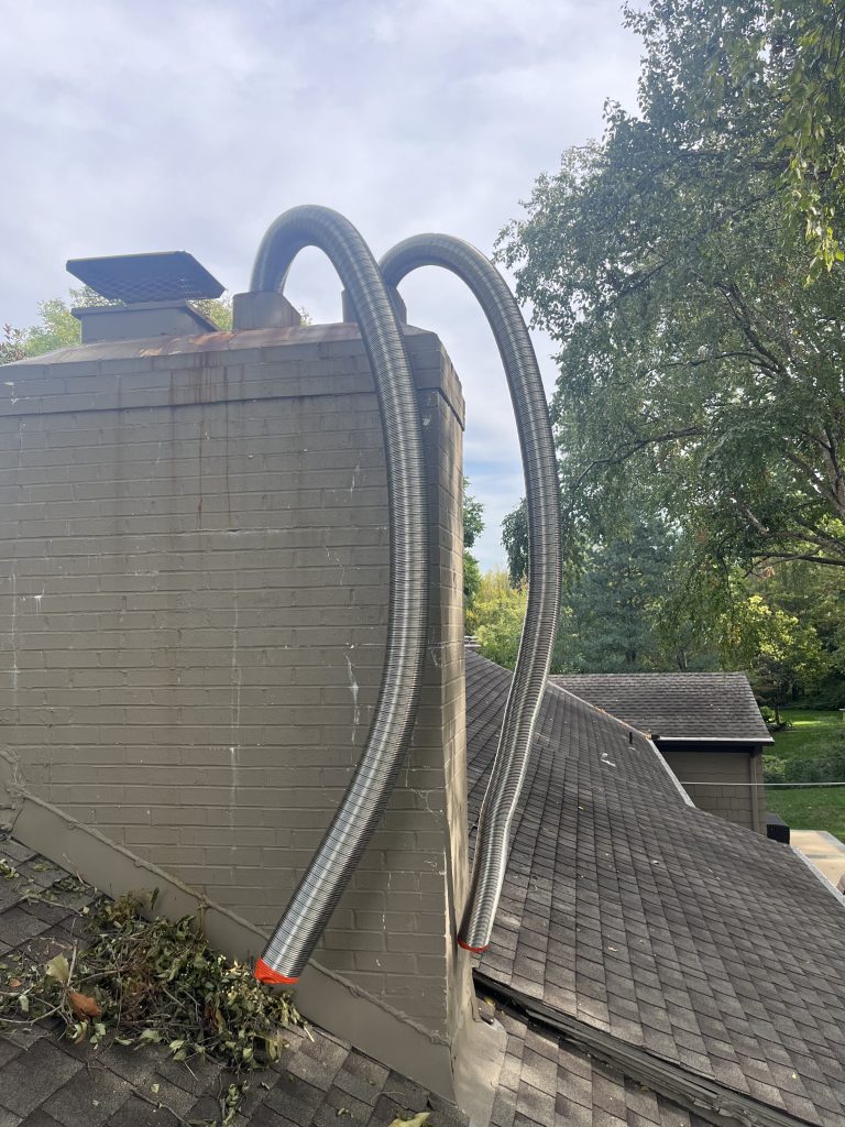 Installing New Stainless Steel Chimney Liner on Double Flue Chimney in Kansas city