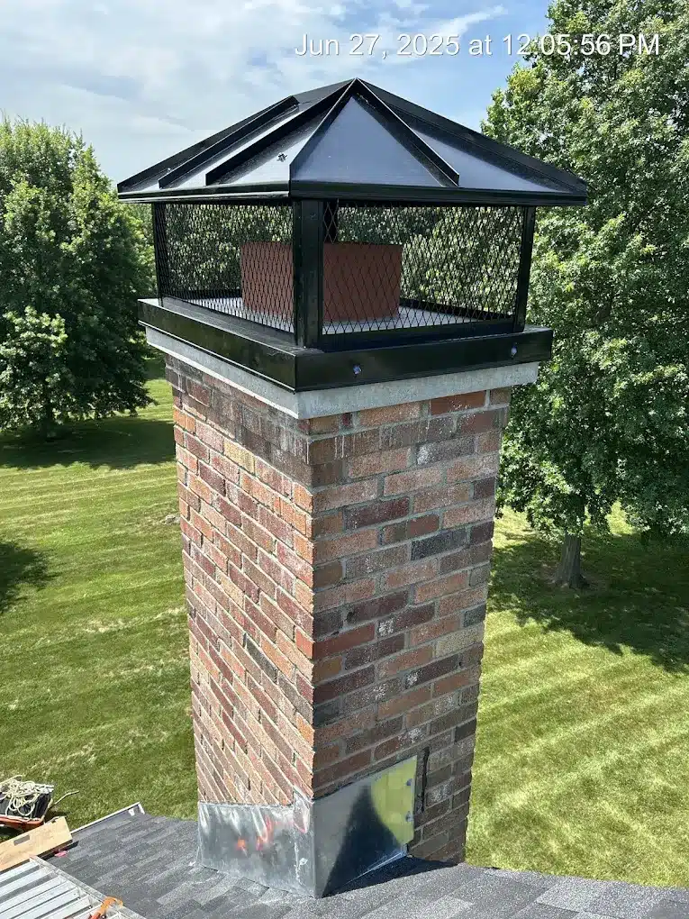 Black Hip Roof Lid Custom CHimney Cap installed on masonry chimney in Kansas City, KS