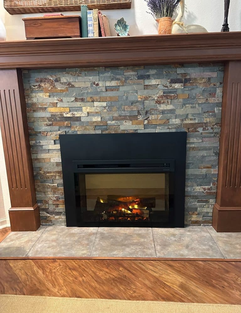 Custom gas fireplace insert installation during fireplace remodeling project in Leawood KS with new fireplace surround construction