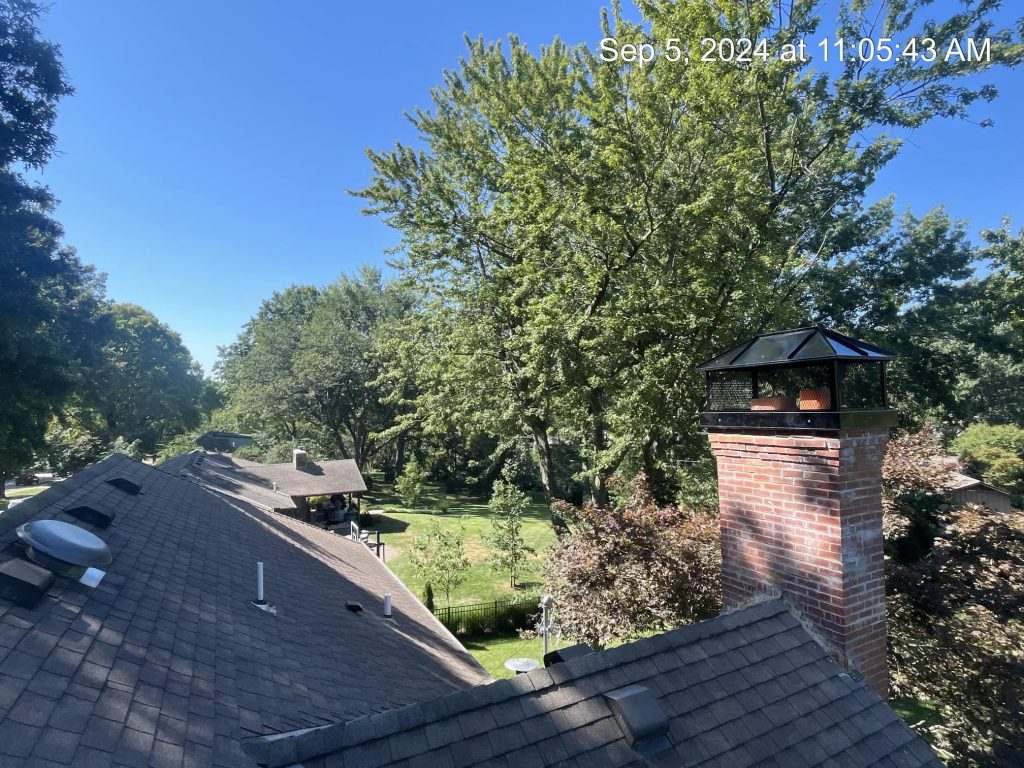 Full-cover custom chimney cap replacement completed on a Kansas City, MO home by Chimney Restoration of KC