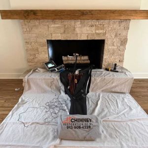 CSIA certified technician performing chimney sweep in Kansas City home