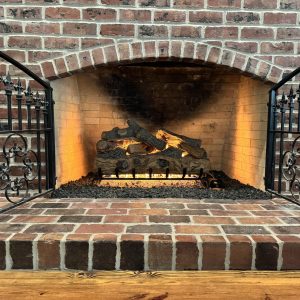 Gas Fireplace burning gas logs installed by our chimney sweep Kansas City