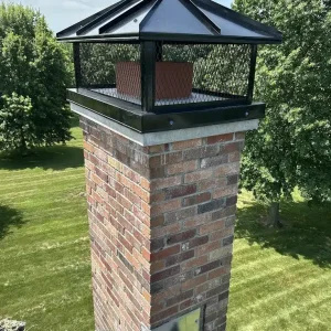 Black Hip Roof Lid Custom CHimney Cap installed on masonry chimney in Kansas City, KS