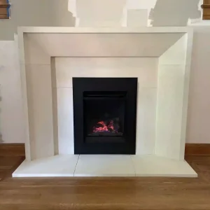 Modern fireplace installation with white surround in Kansas City home