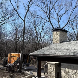 Stone Chimney with Custom Chimney Cap Kansas City - Chimney Restoration of KC